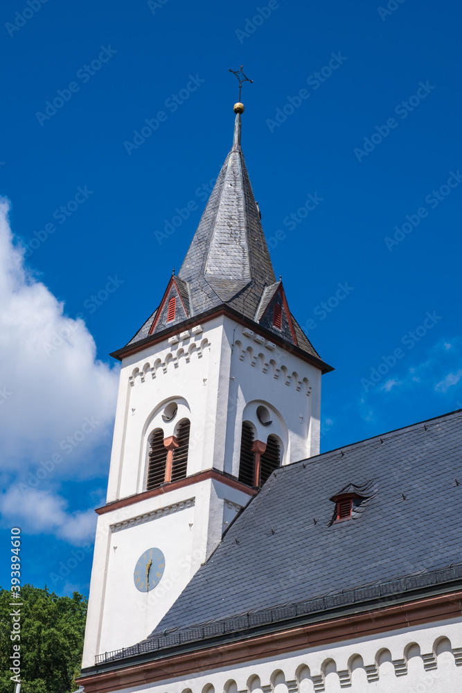 View of the tower of the Protestant church of Bad Soden / Germany in the Taunus with a blue sky