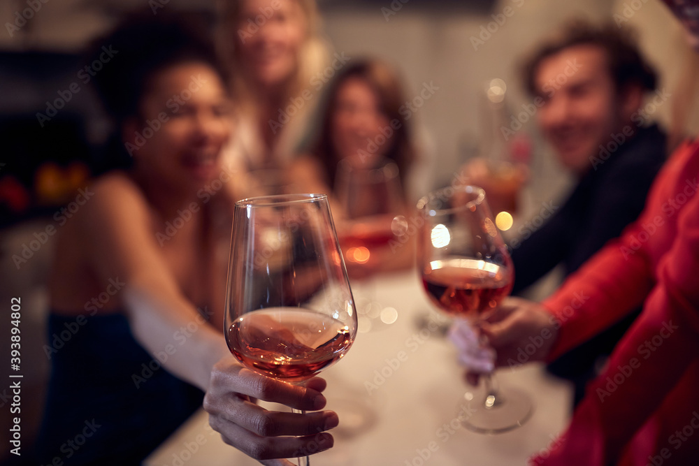 A group of cheerful friends toasting and posing for a photo of New Year eve home party. Friendship, together, party, New Year A group of cheerful friends toasting and posing for a photo of New Year eve home party. Friendship, together, party, New Year