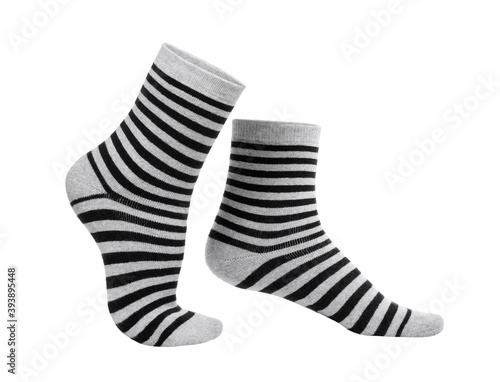 Warm striped black and grey socks isolated on white background.