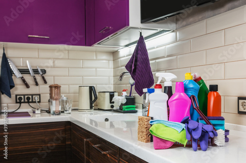 different products and items for cleaning on the countertop in the kitchen. Concept cleaning