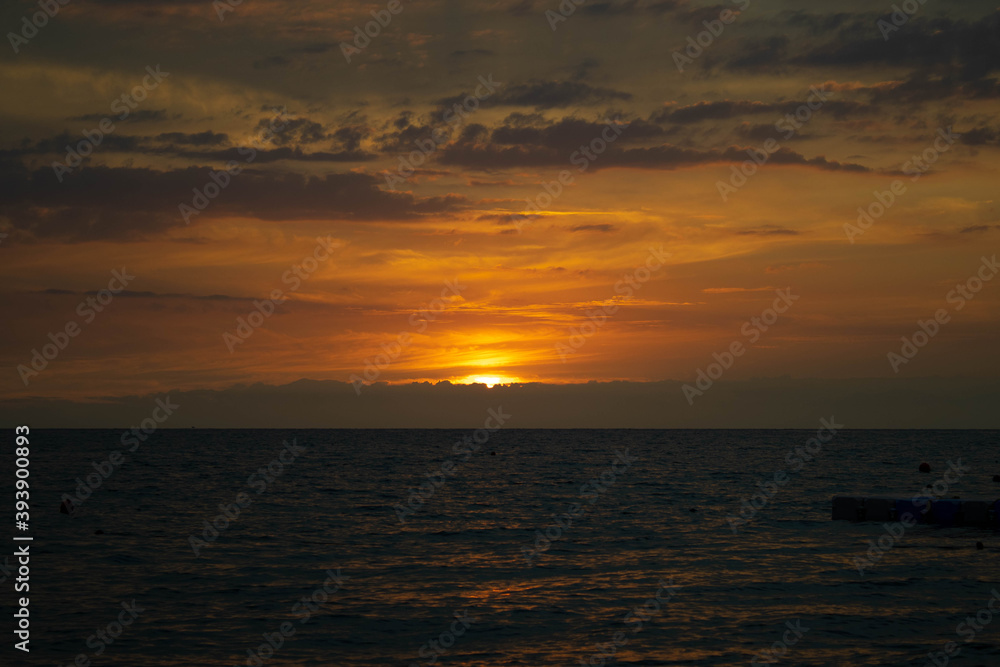Beautiful sunset at the sea in orange tones. Photo of sunset taken in Turkey, Manavgat,2020, during the covid.