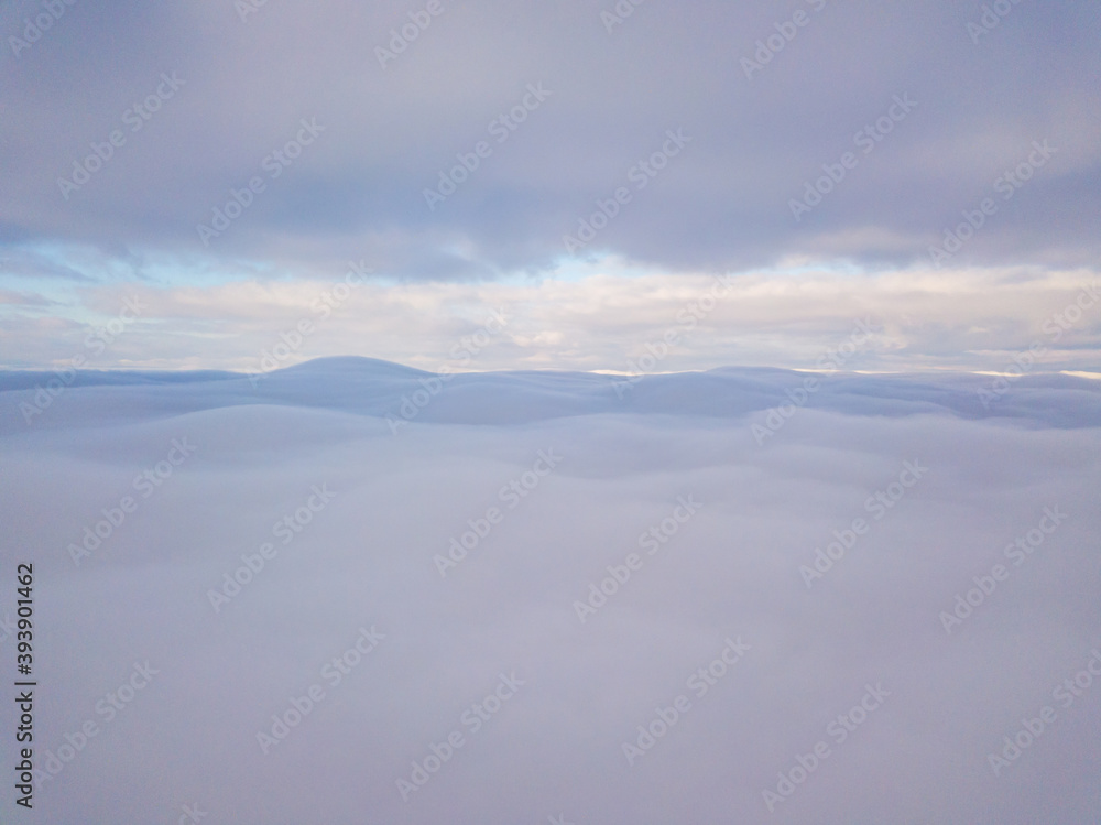 High aerial flight between fog and clouds. High aerial flight between fog and clouds.