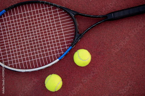 Close up. Tennis racket and balls on court. © ivanko80