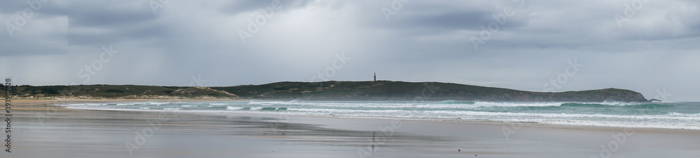 Panorama of Frouxeira beach and lighthouse in Galicia