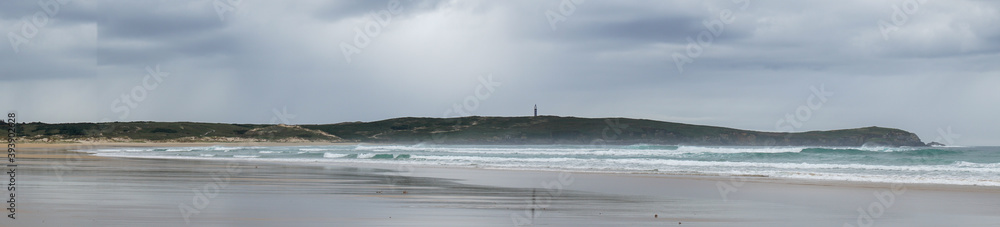 Panorama of Frouxeira beach and lighthouse in Galicia Panorama of Frouxeira beach and lighthouse in Galicia
