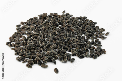 Fotografie Sunflower seeds on white background