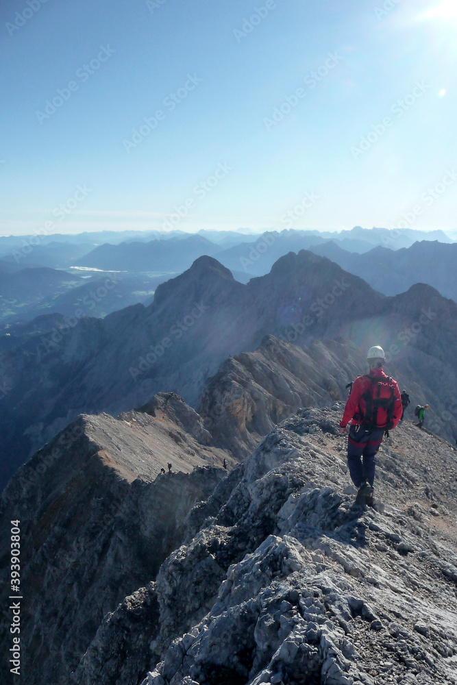 Hiker at climbing route Jubilaumsgrat to Zugspitze mountain, Germany