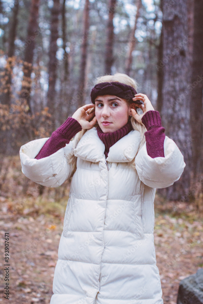 A beautiful girl walks through the winter fairy forest A beautiful girl walks through the winter fairy forest