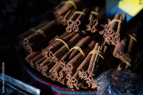Fototapeta Naklejka Na Ścianę i Meble -  Cinnamon sticks highlighted with a sun in one of the many stalls of the Grand Bazaar of Istanbul, Turkey.