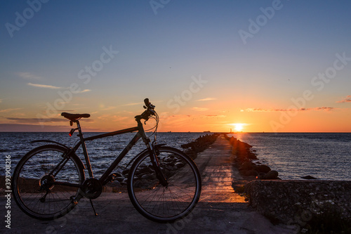 sunset by the beach with a bicycle 
