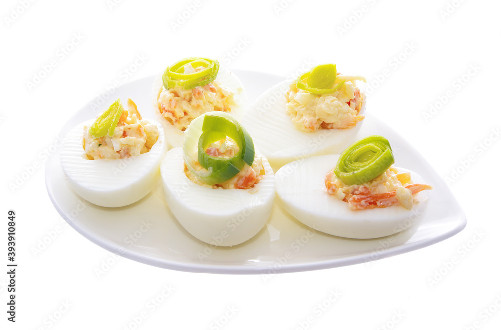 Boiled eggs cut in pieces and served on dish. Boiled eggs cut in pieces and served on dish.