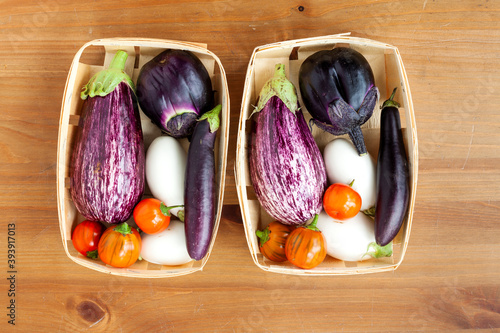 Billede på lærred Portion of various eggplants in two same baskets