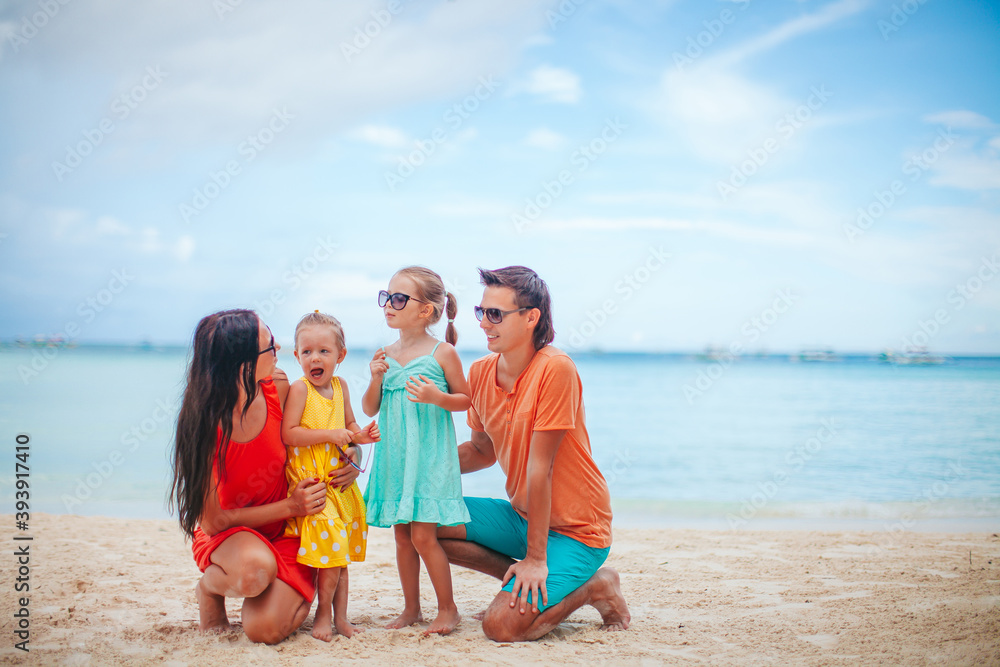 Young family on summer beach vacation