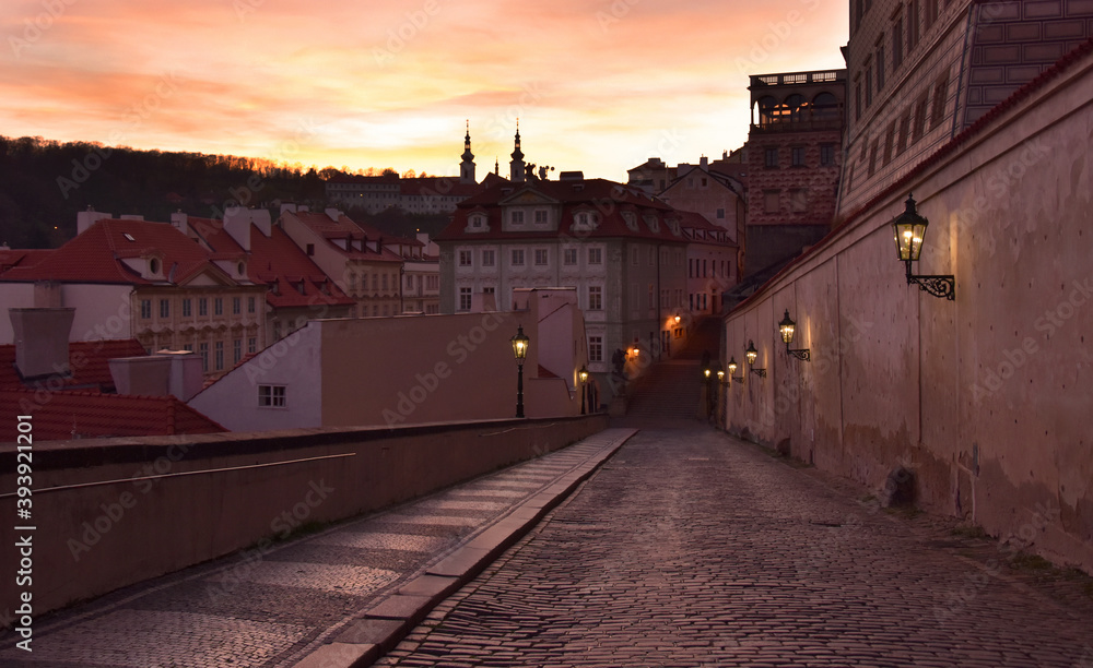 Old Prague street at sunset stock images. Ancient architecture in Prague. Evening Prague old town. Old houses in european city images. Ancient street in Czech Republic. Mysterious Prague stock images