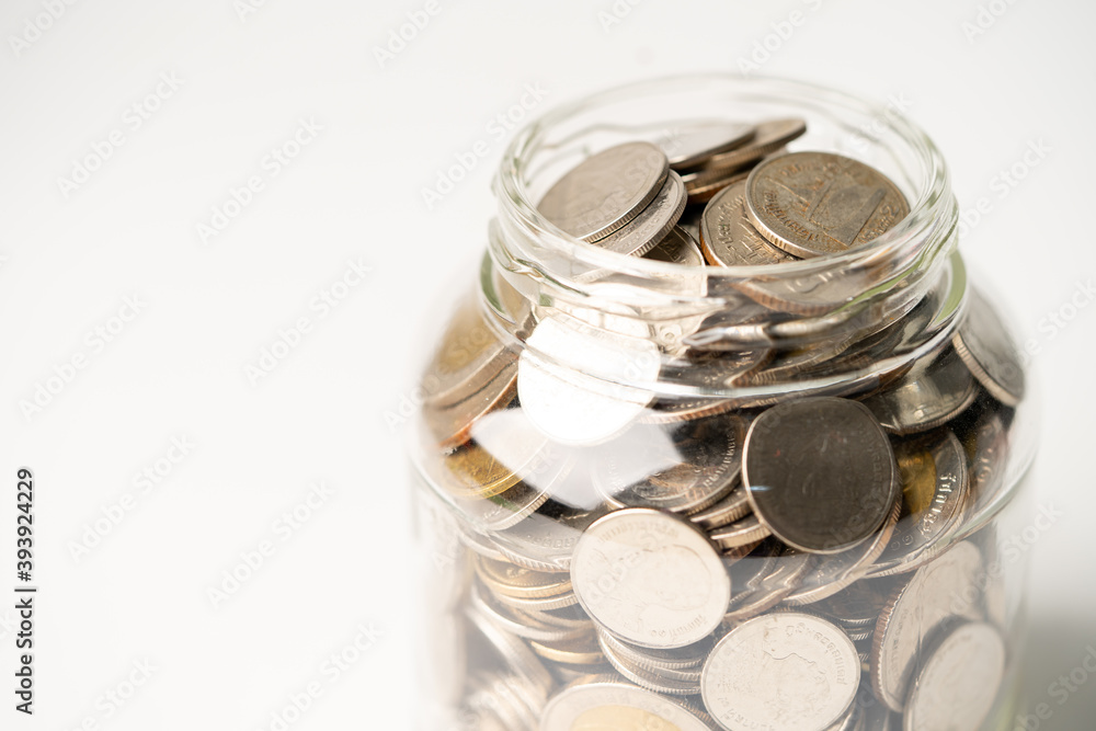 Save money coins in grass jar, Business finance investment concept. Save money coins in grass jar, Business finance investment concept.