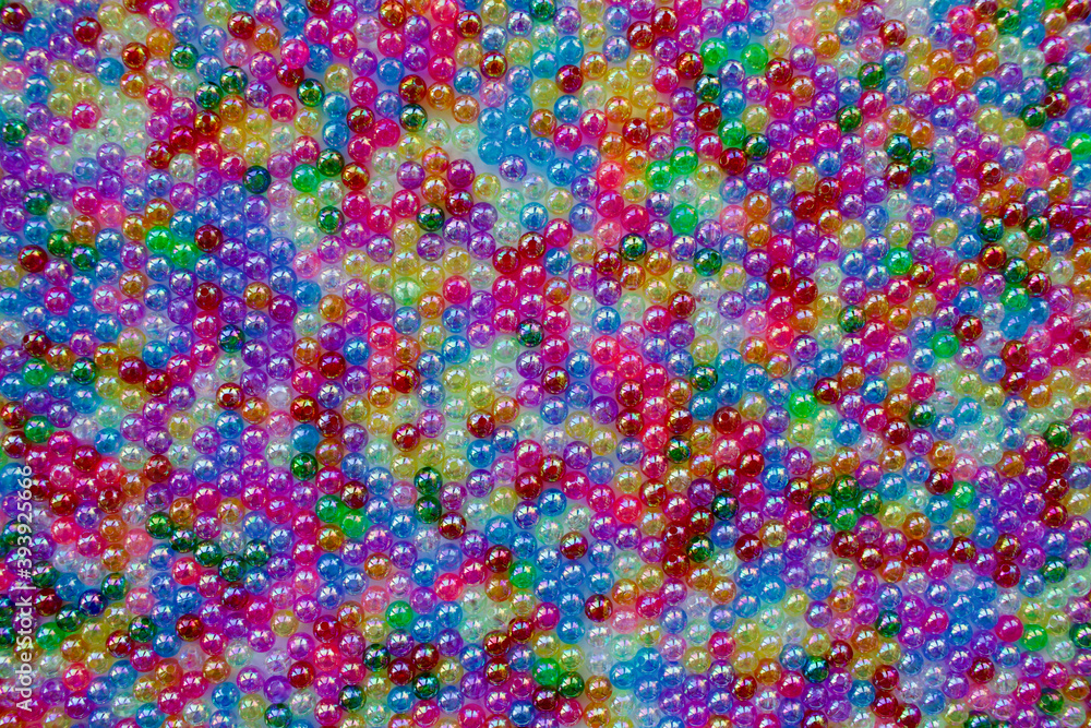 Set of transparent, shiny and many-coloured beads looking like soap bubbles. Seed beads for use in necklaces and bracelets.