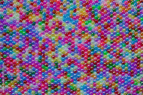 Set of transparent  shiny and many-coloured beads looking like soap bubbles. Seed beads for use in necklaces and bracelets.