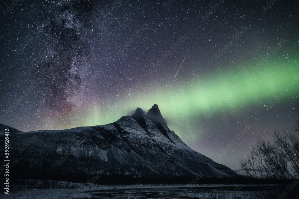 The Milky Way, shooting star and northern lights above a sharp mountain peak (Otertinden) (2)