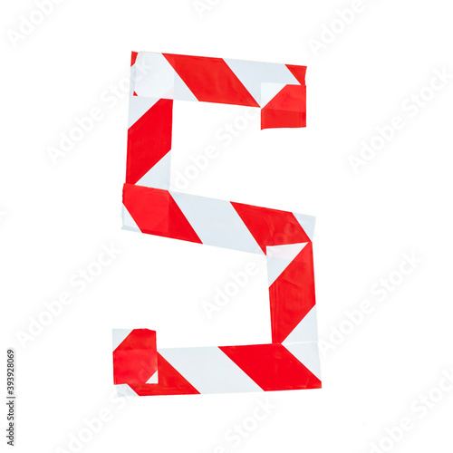Letter S from red and white warning tape. Isolated on white background © Александр Довянский