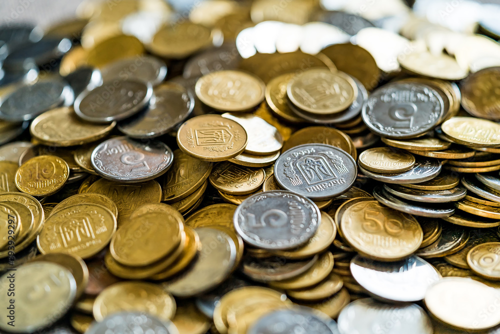 Collectible coins scattered on a surface. Golden and silver coins. View from above. Collectible coins scattered on a surface. Golden and silver coins. View from above.