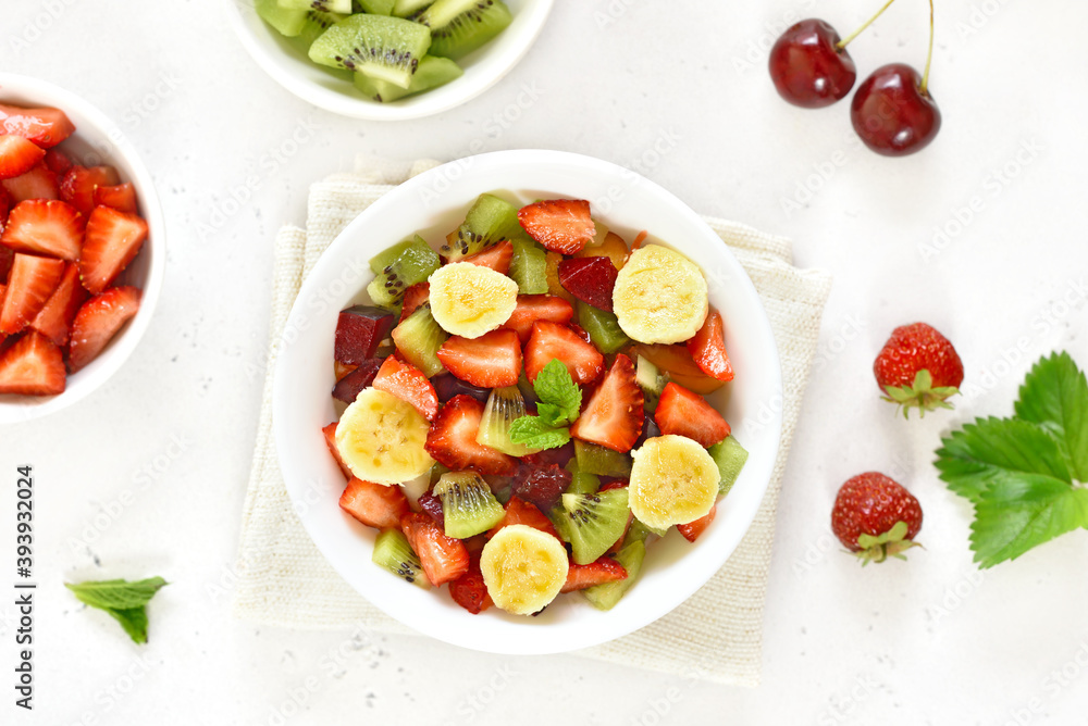 Healthy breakfast with fruit salad from strawberry, kiwi and banana Healthy breakfast with fruit salad from strawberry, kiwi and banana