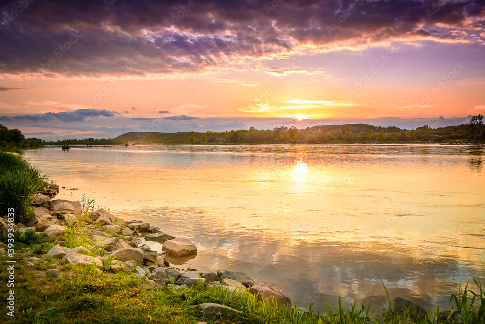 Fototapeta premium reflection in water, river in poland, Kazimierz Dolny, vistula over the sunset