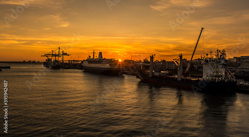A spectacular sunset illuminates the port of Leixoes, near to Porto, Portugal