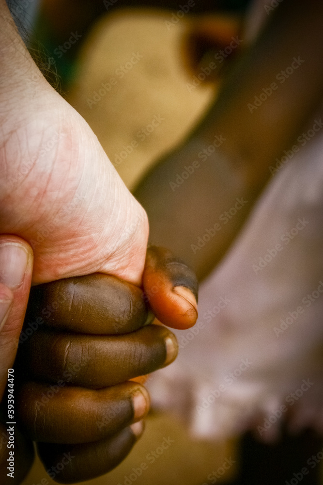multiracial hands united against racism and diversity