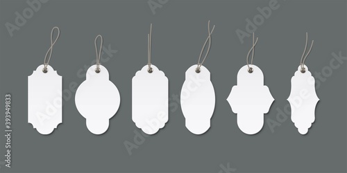 Vintage white price or label tags mockup template set. Blank cards with strings for gifts or sales with different shapes isolated on gray. Empty stickers with thread frames vector illustration