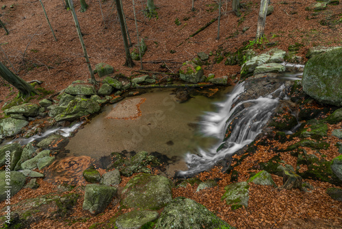 Maly Bily Stolpich waterfall in autumn fresh morning in Jizerske mountains photo