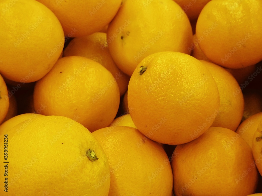 pile of unpeeling and not arrange fresh ripe orange SELECTIVE FOCUS pile of unpeeling and not arrange fresh ripe orange SELECTIVE FOCUS