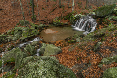 Maly Bily Stolpich waterfall in autumn fresh morning in Jizerske mountains photo