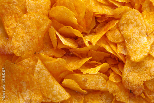 Potato chips or crisps . Close-up of potato chips or crisps. Food background. photo