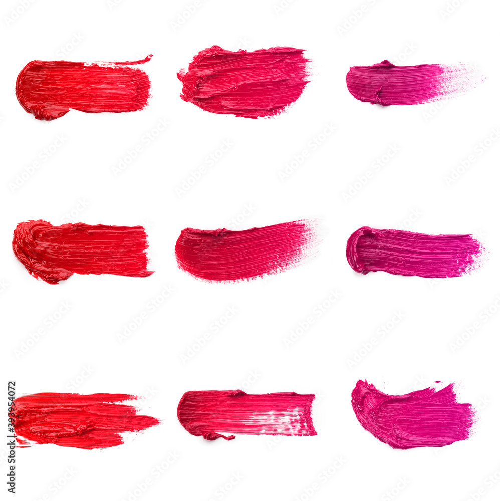 Fototapeta premium Lipstick smear smudge swatch isolated on white background. Cream makeup texture. Bright red color cosmetic product brush stroke swipe sample