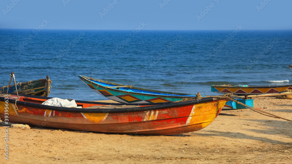Fototapeta premium Colorful fishermen boats at Rushikonda beach near Visakhapatnam city in India.