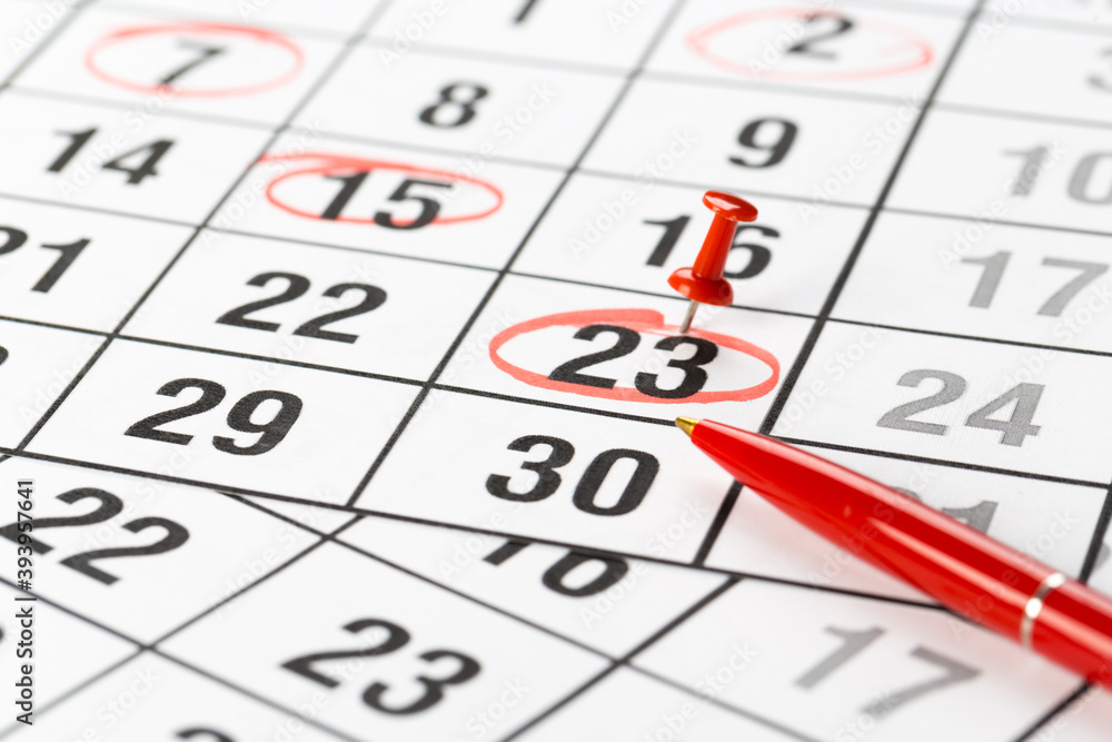 red buttons on the calendar. Concept idea for planning. An important date, business trip, or meeting reminder. red buttons on the calendar. Concept idea for planning. An important date, business trip, or meeting reminder.