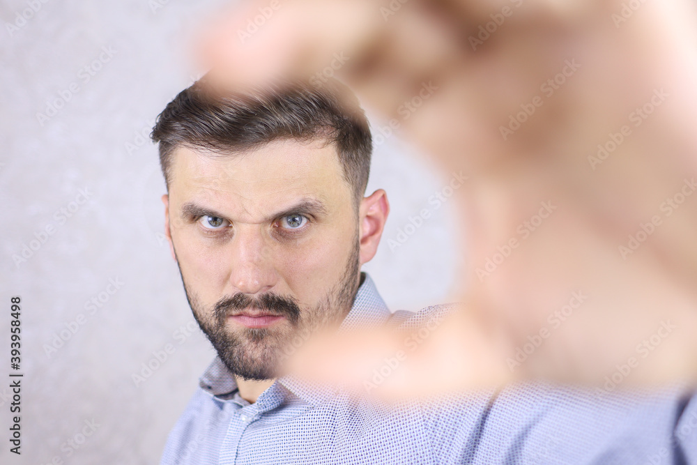 Fototapeta premium man showing sign with fingers