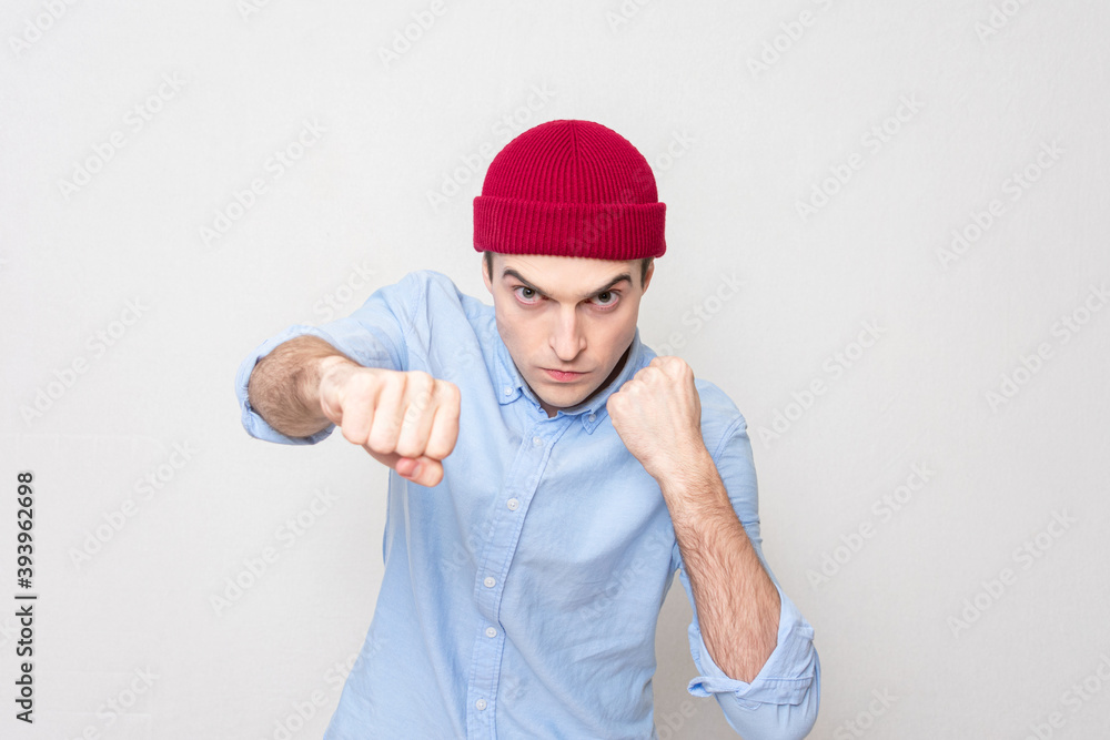 Naklejka premium Single-minded man is ready to fight with his fists, portrait