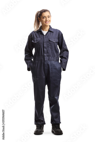 Fotografie Full length portrait of a female worker in an overall uniform