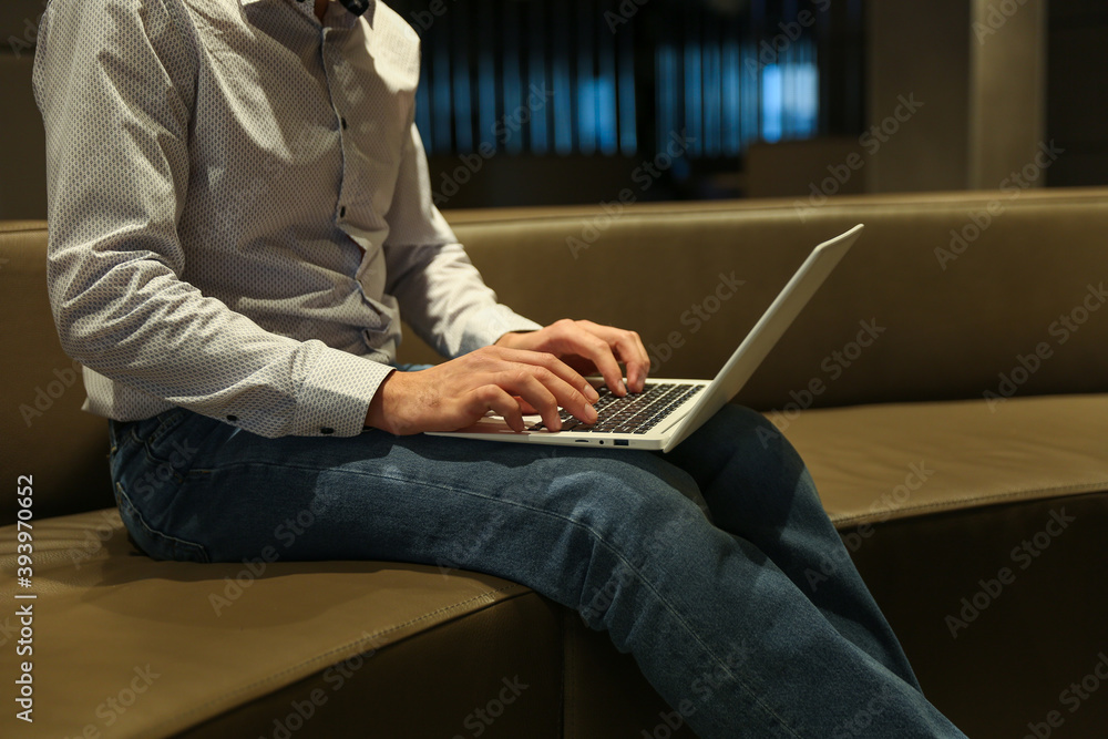 man typing on laptop in the hotel close up man typing on laptop in the hotel close up