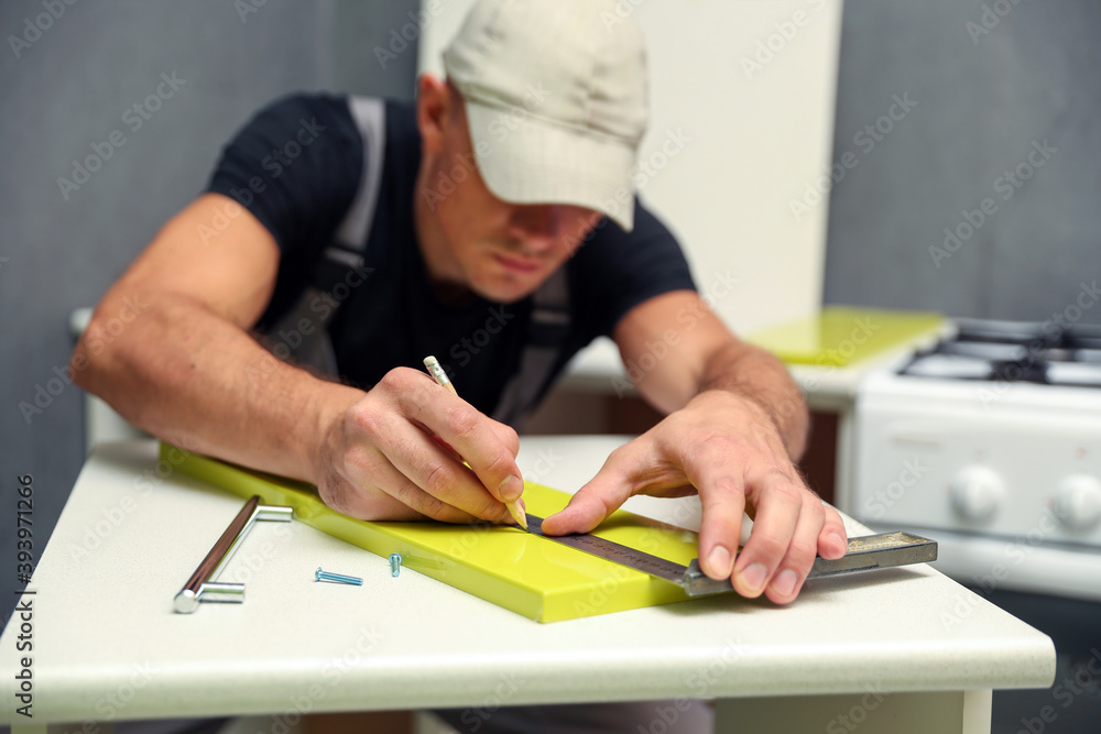 furniture assembling concept close up. building a new kitchen furniture furniture assembling concept close up. building a new kitchen furniture