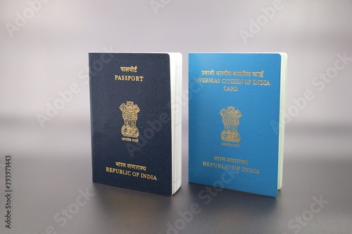 Drammen, Norway - November 20 2020: Indian passport and Overseas Citizen of India (OCI) card on gradient background.