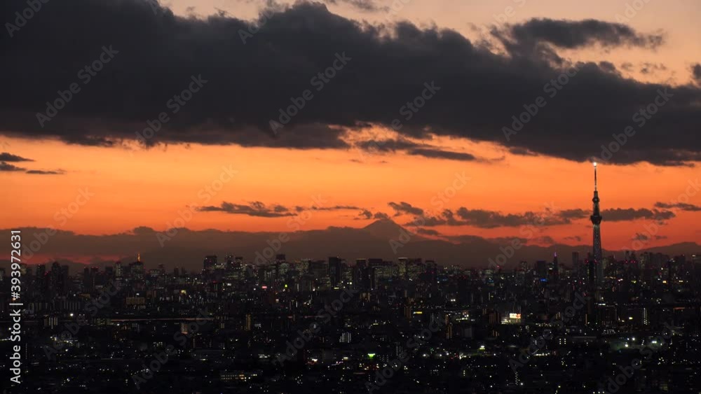 TOKYO, JAPAN : Aerial high angle sunrise CITYSCAPE of TOKYO and MOUNT FUJI. View of rising sun and buildings at downtown area. Japanese city life and nature concept. Time lapse shot night to morning. TOKYO, JAPAN : Aerial high angle sunrise CITYSCAPE of TOKYO and MOUNT FUJI. View of rising sun and buildings at downtown area. Japanese city life and nature concept. Time lapse shot night to morning.