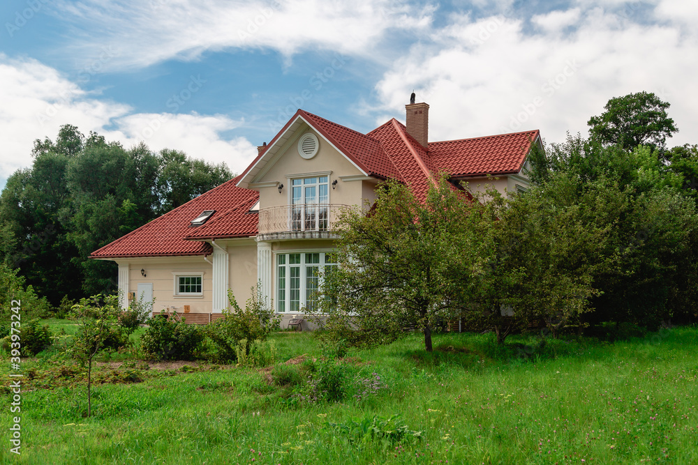 Country house on a green meadow