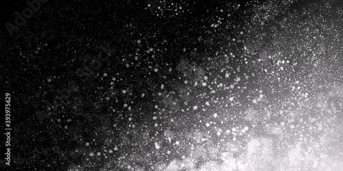 black-white grunge background dark with spots and grains. abstract simple backdrop for banners, web, prints
