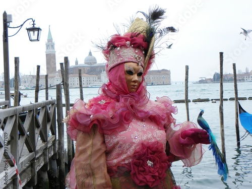Pink costume, gondolas, venetian carnival masks © damaisin1979