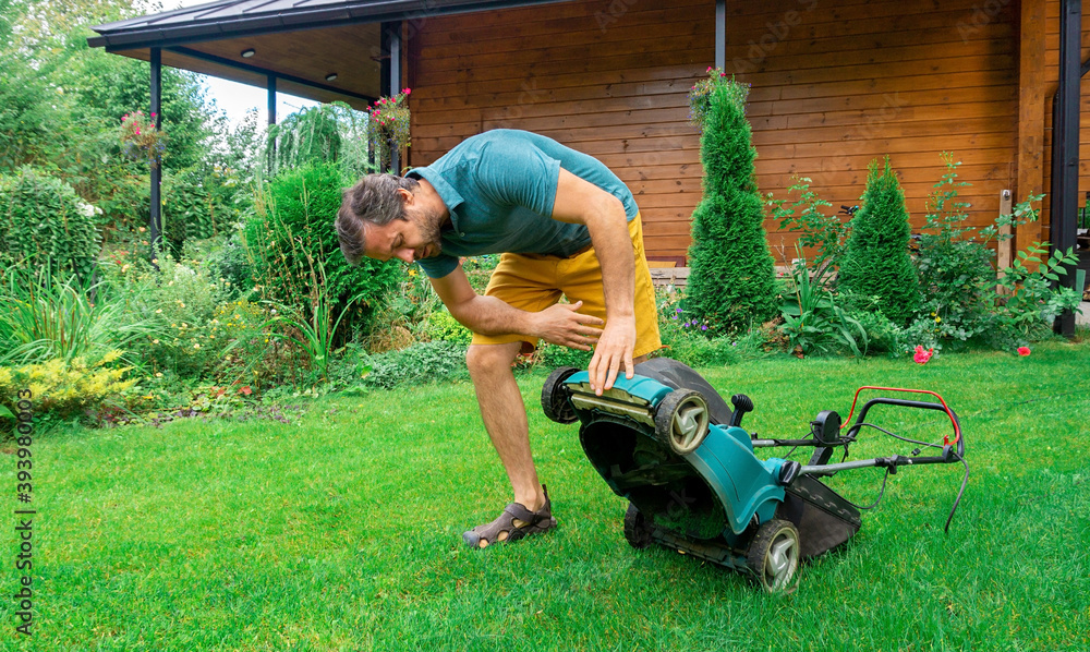 Electric lawn mower breakdown. Malfunctioning garden tools. The