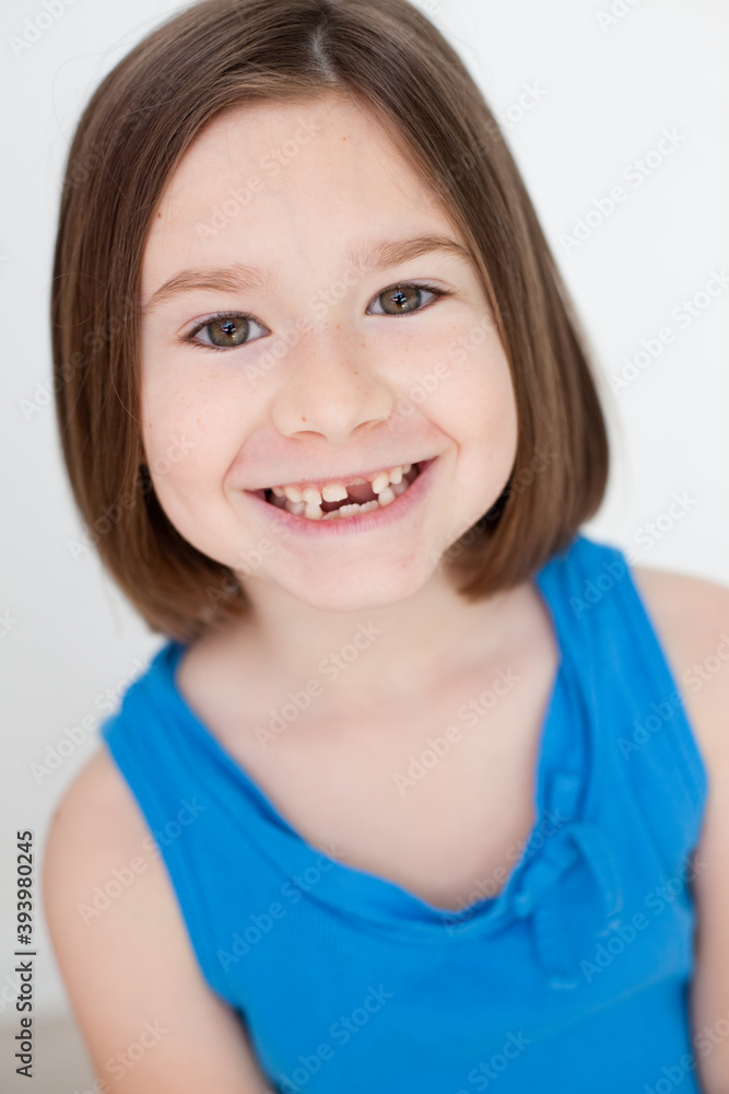Smiling Little Girl with Brown Hair and Missing Teeth, Happy Childhood Portrait Smiling Little Girl with Brown Hair and Missing Teeth, Happy Childhood Portrait