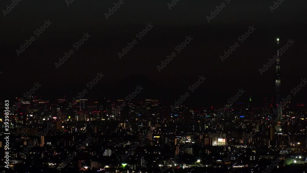 TOKYO, JAPAN : Aerial sunrise CITYSCAPE of TOKYO and MOUNT FUJI. View of rising sun and buildings at downtown. Japanese city life and nature concept. Time lapse tracking shot night to morning. TOKYO, JAPAN : Aerial sunrise CITYSCAPE of TOKYO and MOUNT FUJI. View of rising sun and buildings at downtown. Japanese city life and nature concept. Time lapse tracking shot night to morning.