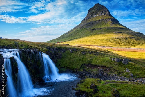 Landscape of Kirkjufellsfoss waterfall and Kirkjufell mountain, Iceland, Europe.